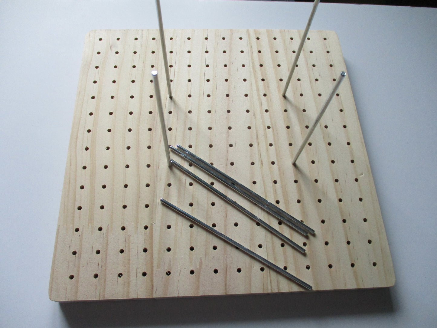 Wooden blocking board with dowels