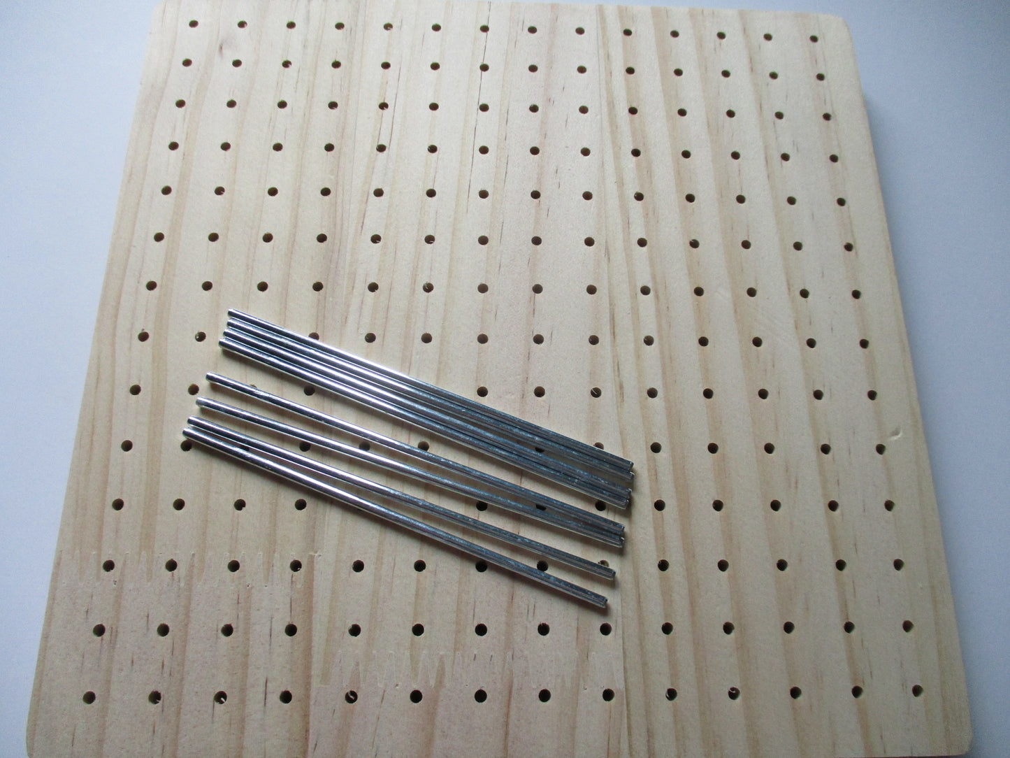 Wooden blocking board with dowels